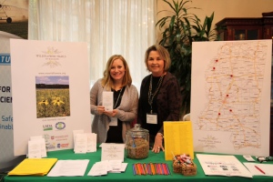 Keep Mississippi Beautiful's Neeley Norman and Sarah Kountouris tell conservationists about wildflowers at recent Mississippi Association of Conservation Districts annual meeting. Photo by Judi Craddock. 